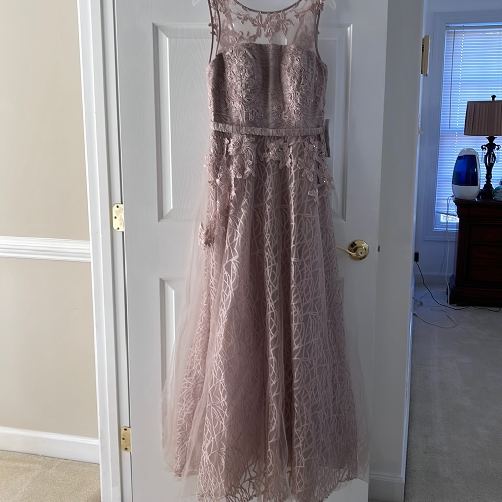 Brand new never wear it . In light blush color